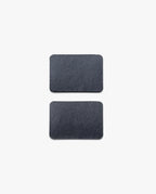 Two rectangular, black slate tiles with rounded corners—part of the Warehouse Item - Magnet Kit (Pen Tray and Analog Weekly)—are placed vertically on a plain white background, one above the other.
