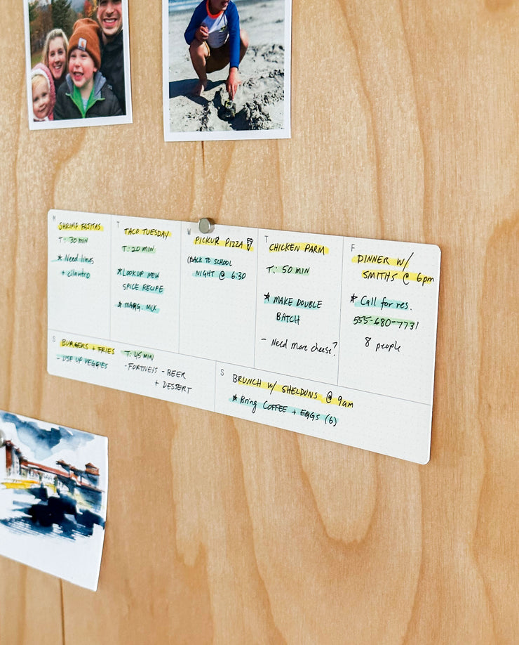 The Analog Weekly Planning Kit (Maple) features a maple board with photo slots, a postcard, color-coded notes, Weekly Planner Cards, and space to organize your meals, tasks, and appointments.