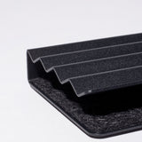 Close-up of the Gather Zigzag Tray (2x1 - Black) with four raised ridges and a wool felt-lined interior, showcasing its black textured surface and modern, minimalist design on a white background.