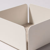 The Gather Small Tray (1x1 - White) is a minimalist, white square tray with rounded corners and a felt-lined base, ideal as a desk organizer. Made in Pennsylvania, it sits perfectly on any light surface.