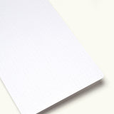 A close-up of an Analog Today Card (from the 12-Pack): a white rectangular sheet with rounded corners and faint, evenly spaced dots, resembling classic note cards, set against a plain light background.