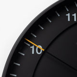 A close-up of the Braun Wall Clock (Black), celebrated for its minimalist design and easy-to-read clock face.