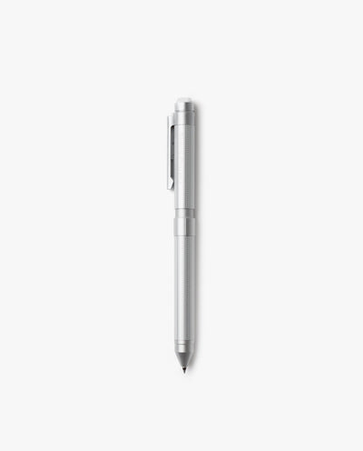The Craft Design Technology Multifunctional Pen, featuring a silver finish, textured grip, and pocket clip, stands vertically against a plain white background.