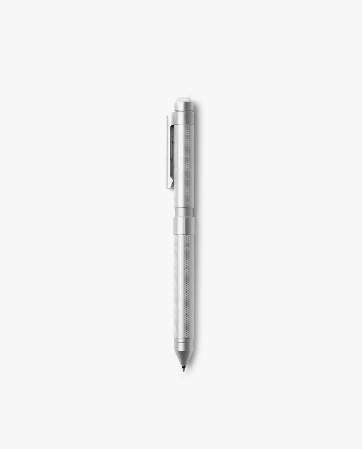 The Craft Design Technology Multifunctional Pen, featuring a silver finish, textured grip, and pocket clip, stands vertically against a plain white background.