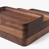 The Valet Tray (Walnut - Small) is handcrafted in Pennsylvania with smooth, rounded edges and a natural grain pattern—ideal for storing your everyday essentials.