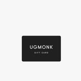A black rectangular Ugmonk Gift Card features white capital letters on a light gray background—ideal for convenient email delivery of digital gift cards.