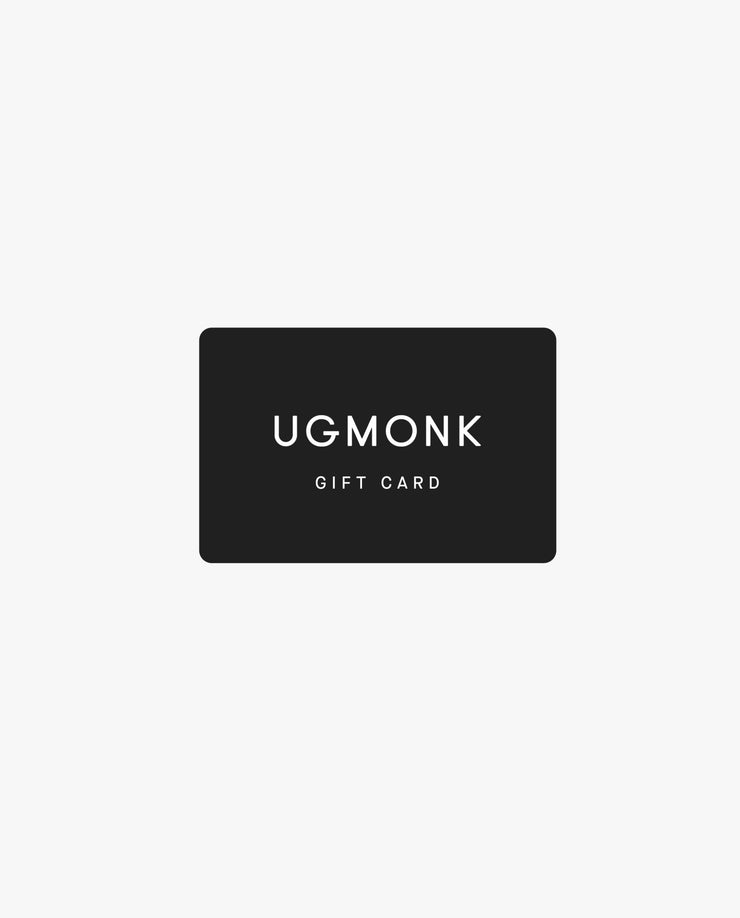 A black rectangular Ugmonk Gift Card features white capital letters on a light gray background—ideal for convenient email delivery of digital gift cards.