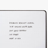 The Discbound Heirloom Journal (Black Leather - Standard 6" x 8.5") features full-grain leather, 70# smooth white dot grid pages (120 sheets), a refillable discbound design, and is made in the USA.