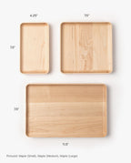 Three handcrafted Valet Trays (Maple - Small) are displayed on a white background. The set includes three sizes: small (4.25 x 7.5), medium (7.5 x 7.5), and large (11.5 x 7.5), each featuring beautifully rounded corners for a refined finish.