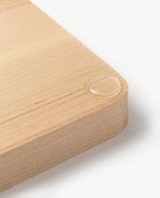 A close-up of the Valet Tray Bundle (Maple - Set of 3) handcrafted in Pennsylvania shows smooth, rounded corners and a single water droplet that highlights the maple wood’s natural texture and refined finish.