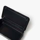 The Toyo Steel Stackable Storage Box T-190 (Black) is a black, rectangular steel toolbox with rounded corners, shown open on a white background. Made in Japan, it boasts an empty interior for versatile, durable storage and easy stacking.