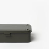 The Toyo Steel Stackable Storage Box T-190 in Military Green is a minimalist Japanese-made steel box with rounded edges, a flat screw-fastened lid, and stackable design, shown partially set against a plain white background.