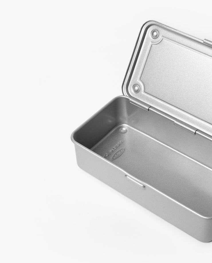 The Toyo Steel Stackable Storage Box T-190 (Silver), made in Japan, is a rectangular steel toolbox with a hinged lid partially open, revealing an empty interior. It is shown on a plain white background.