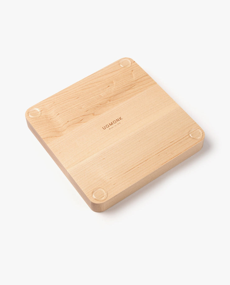 The Valet Tray (Maple - Medium) features handcrafted solid maple, rounded edges, four small circular corner feet, and "UGMONK" engraved in the center. It rests elegantly on a white background.