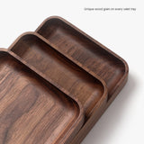 The Valet Tray (Walnut - Small) features a smooth finish and unique wood grain, handcrafted in Pennsylvania—ideal for storing everyday carry items. Each tray is one-of-a-kind due to natural walnut variations.