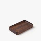 The Valet Tray (Walnut - Small) is a handcrafted rectangular walnut tray with rounded edges and a smooth finish, made in Pennsylvania for everyday carry storage. Shown on a white background.