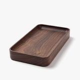 The Valet Tray (Walnut - Small) is a handcrafted, rectangular tray with rounded edges and a smooth dark walnut finish, made in Pennsylvania—ideal for storing everyday essentials. Shown on a plain white background.