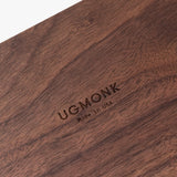 A close-up of the polished walnut surface engraved with "UGMONK Made in USA," showcasing the small Valet Tray—ideal for everyday carry storage and handcrafted in Pennsylvania.
