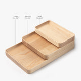 The Valet Tray Bundle (Maple - Set of 3) features handcrafted trays from Pennsylvania, each with rounded edges: Large (7.5x11.5"), Medium (7.5x7.5"), and Small (7.5x4.25")—perfect for versatile organization.