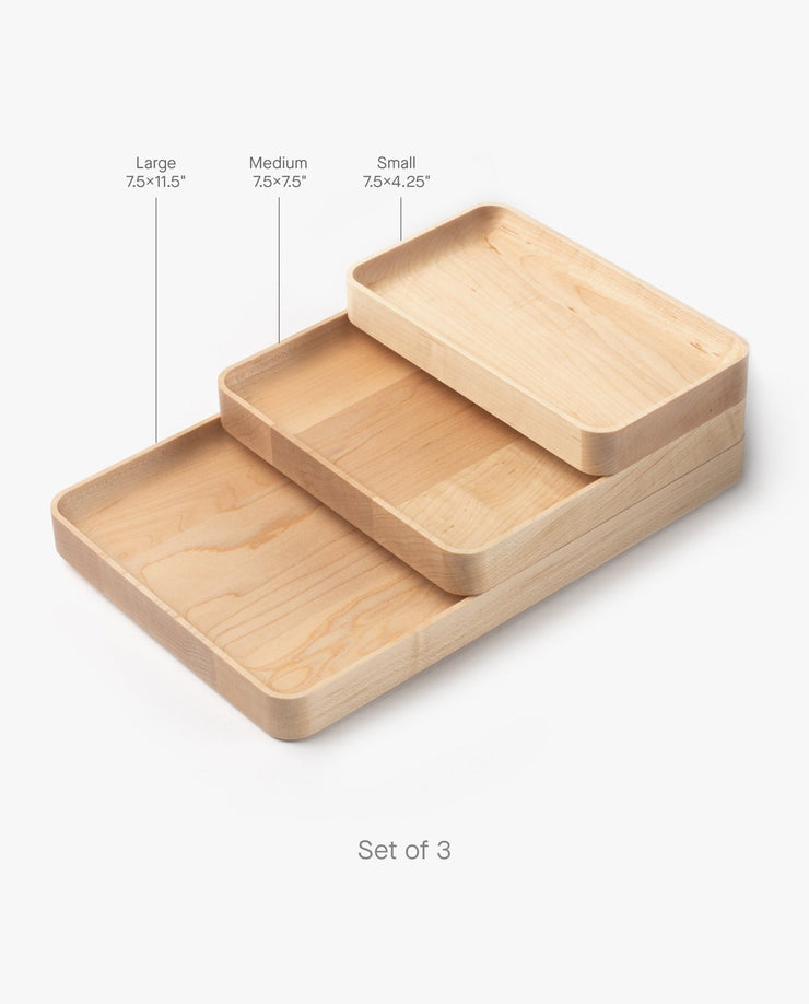 The Valet Tray Bundle (Maple - Set of 3) features handcrafted trays from Pennsylvania, each with rounded edges: Large (7.5x11.5"), Medium (7.5x7.5"), and Small (7.5x4.25")—perfect for versatile organization.